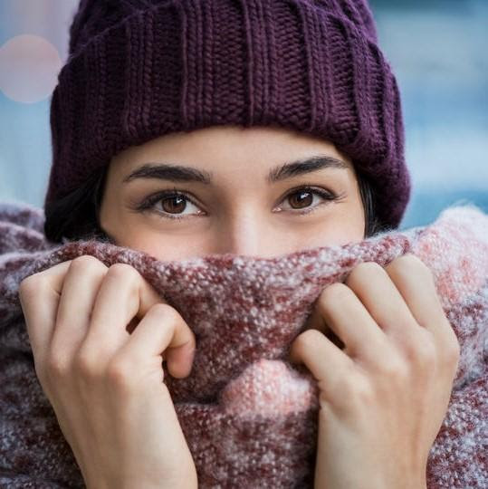 Woman in scarf and hat
